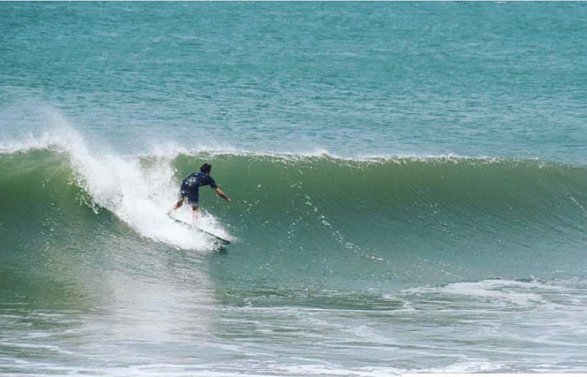 Surfer on a large wave in El Transito, Nicaragua