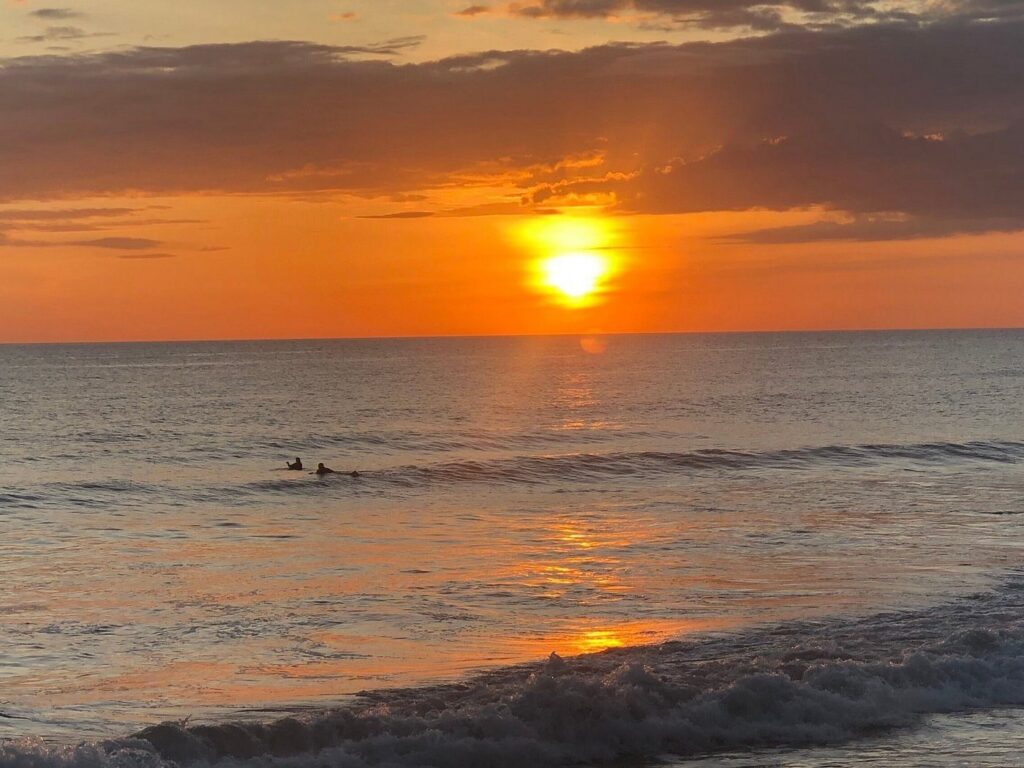 Two Surfers Waiting for a Sunset Wave