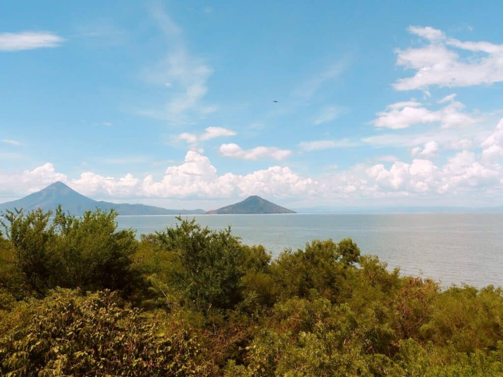 view of volcanoes across the water on the way to leon, nicaragua